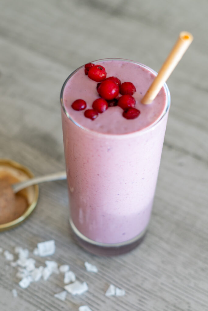 picture of a pink berry smoothie for postpartum nutrition